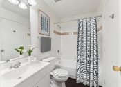 Thumbnail 40 of 40 - a white bathroom with a black and white shower curtain at Residences at Westborough Station, Westborough