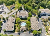 Thumbnail 23 of 40 - an aerial view of a neighborhood of houses with a swimming pool at Residences at Westborough Station, Westborough, 01581