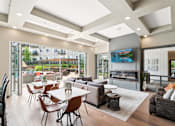 Thumbnail 15 of 29 - A modern living room with a fireplace and a view of the city.