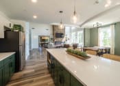 Thumbnail 16 of 33 - a clubroom kitchen with an island at Edgebrook Residences, Merrimack, 03054