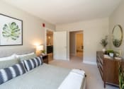 Thumbnail 6 of 33 - a bedroom with a bed and a dresser at Edgebrook Residences, New Hampshire, 03054