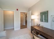Thumbnail 8 of 33 - a office with a desk and a closet at Edgebrook Residences, Merrimack