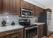 Thumbnail 7 of 50 - Kitchen with stainless steel appliances at The Canyons at Linda Vista Trail, Arizona, 85704