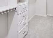Thumbnail 17 of 40 - a spacious closet with white walls and drawers at Maven on Broadway, Minnesota, 55904