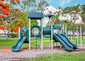 Thumbnail 24 of 41 - A playground with a green slide and a blue and green play structure.