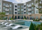 Thumbnail 2 of 19 - Pool with tanning ledge at Lofts at Zebulon, Macon, 31210