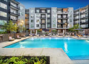 Thumbnail 2 of 24 - Resort style swimming pool at Glenn Perimeter, Atlanta, GA
