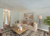 Thumbnail 3 of 12 - a living room with a couch and a table at Randolph Park, Charlotte, NC