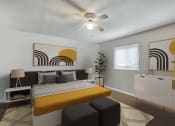 Thumbnail 5 of 12 - a bedroom with a bed and a ceiling fan at Randolph Park, Charlotte, 28211