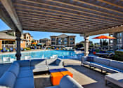 Thumbnail 3 of 37 - Poolside patio and lounge area at The Legend, Waco, TX, 76712