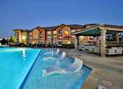 Thumbnail 12 of 37 - Pool with Immersed Loungers at The Legend, Waco, TX, 76712