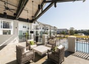 Thumbnail 4 of 37 - Clubhouse outdoor seating at Wharf 7 Apartments, South Carolina