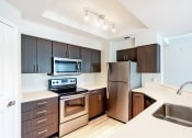 Thumbnail 9 of 23 - Deluxe Home Kitchen at Sedona Springs, Austin, TX, 78749