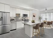 Thumbnail 1 of 12 - a kitchen with white cabinetry and stainless steel appliances  at SLX Atlanta, Chamblee, Georgia
