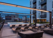Thumbnail 29 of 40 - spa pool deck at dusk with a view at Maven on Broadway, Rochester, MN