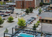 Thumbnail 8 of 40 - a view of the city from the top of a building with a pool at Maven on Broadway, Minnesota
