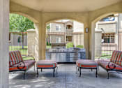 Thumbnail 20 of 27 - Outdoor patio seating with grills at Links at High Resort, Rio Rancho, New Mexico