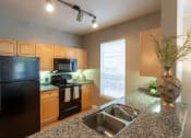 Thumbnail 20 of 41 - Kitchen at The Park at Monterey Oaks, Austin, TX