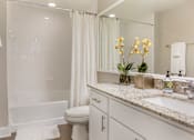 Thumbnail 14 of 41 - A white bathroom l at Floresta apartments in Jupiter, FL
