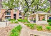 Thumbnail 23 of 31 - Outdoor courtyard at Village Oaks Apartments, Texas, 78759