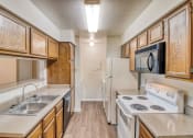 Thumbnail 9 of 31 - Kitchen at Village Oaks Apartments, Austin, 78759