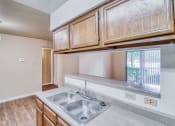 Thumbnail 10 of 31 - Kitchen with sink at Village Oaks Apartments, Austin