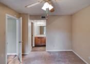 Thumbnail 26 of 31 - Bedroom with ceiling light at Village Oaks Apartments, Austin, Texas