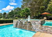 Thumbnail 10 of 25 - a swimming pool with a fountain at 670 Thornton, Lithia Springs