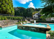 Thumbnail 8 of 25 - a pool with a fountain at 670 Thornton, Lithia Springs, Georgia
