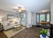 Thumbnail 18 of 25 - a living room with a ceiling fan and hardwood flooring at 670 Thornton, Lithia Springs, GA