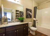 Thumbnail 20 of 36 - a bathroom with a sink and a toilet and a shower at Estate at Woodmen Ridge, Colorado Springs