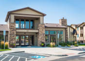Thumbnail 33 of 36 - a building with a parking lot in front of it at Estate at Woodmen Ridge, Colorado Springs