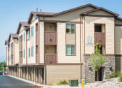 Thumbnail 18 of 36 - the exterior of a building with a street in front of it at Estate at Woodmen Ridge, Colorado Springs Colorado