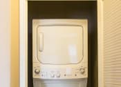 Thumbnail 21 of 36 - a white washer and dryer in a closet at Estate at Woodmen Ridge, Colorado Springs, CO 80923