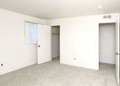Thumbnail 7 of 12 - an empty room with white walls and a closet