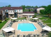 Thumbnail 4 of 12 - an aerial view of an outdoor pool with chairs and umbrellas