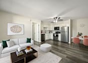 Thumbnail 5 of 14 - A modern living room with a white couch and a coffee table.