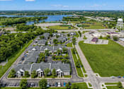 Thumbnail 2 of 20 - A bird's eye view of a residential area with houses, roads, and a water tower.