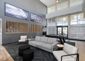 Thumbnail 18 of 21 - a living room with a gray couch and a pool table