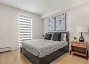 Thumbnail 10 of 21 - a bedroom with a bed and a window