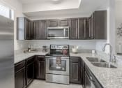 Thumbnail 4 of 18 - Apartment Kitchen at Portofino Landings, Fort Pierce, FL
