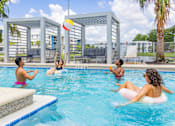 Thumbnail 18 of 27 - People playing in a pool with a ball.at Icon One, Daytona Beach, Florida