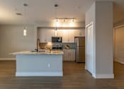 Thumbnail 6 of 31 - Kitchen with white island at The Falls of Portofino , Naples, Florida