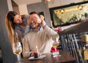 Thumbnail 22 of 48 - a woman covering a mans eyes in a restaurant at The Falls of Portofino, Naples, FL, 34119