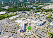 Thumbnail 13 of 27 - An aerial view of a large city with a mix of buildings and green spaces.at Icon One, Daytona Beach, Florida