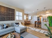 Thumbnail 8 of 27 - Living Room With Kitchen View at Icon One, Daytona Beach, 32114