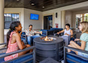 Thumbnail 8 of 24 - Group of people sitting around firepit at Portofino Cove, Fort Myers, 33916