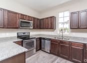 Thumbnail 15 of 25 - Kitchen at Playa Apartments, Florida
