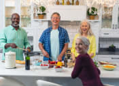 Thumbnail 2 of 48 - a group of people in a kitchen preparing food at The Falls of Portofino, Naples, FL