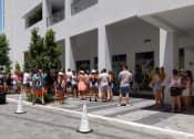 Thumbnail 11 of 12 - Fans wait in line at The Easton for an exclusive musical performance